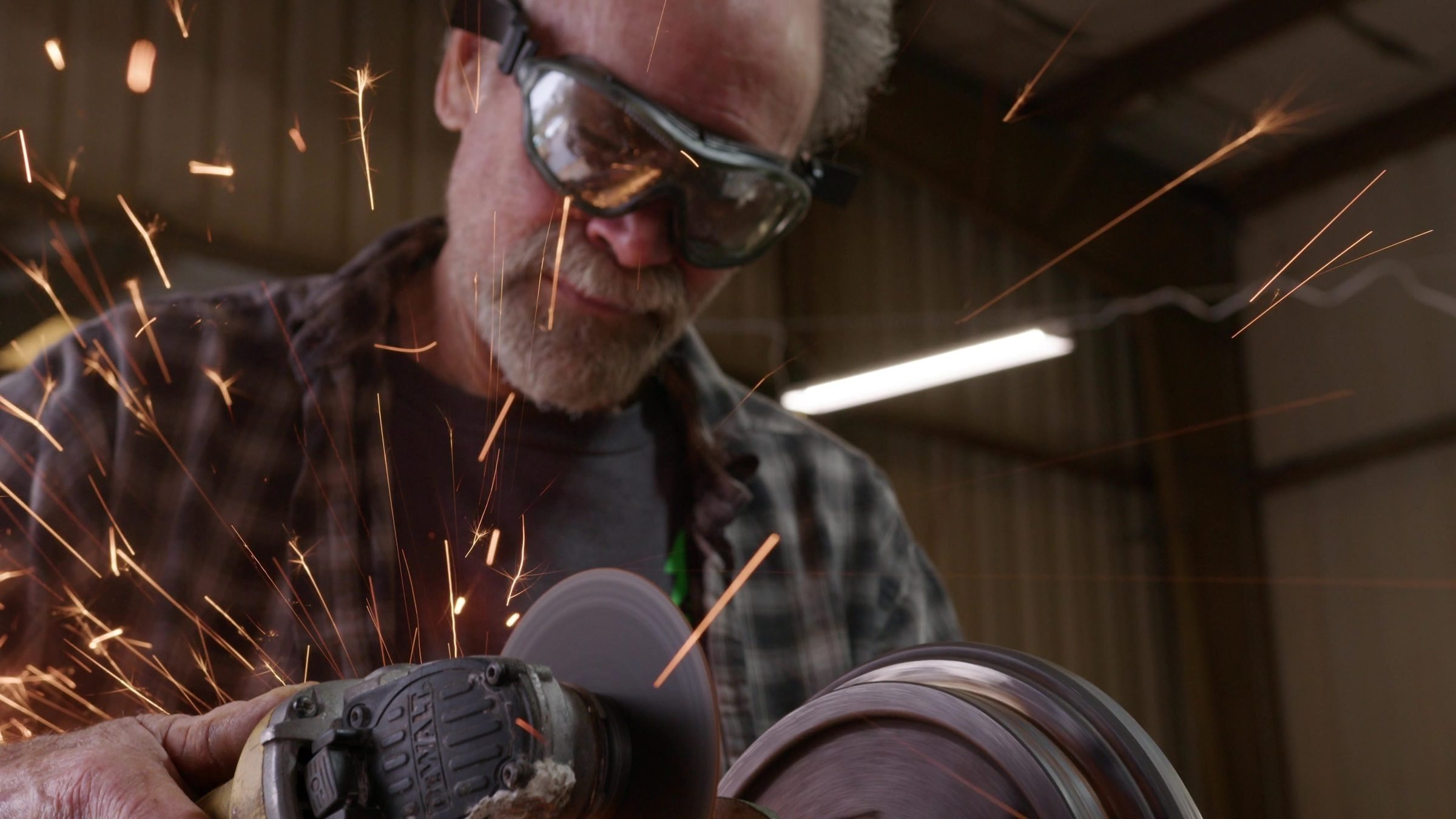Steve Clunn grinding a brake drum as sparks fly