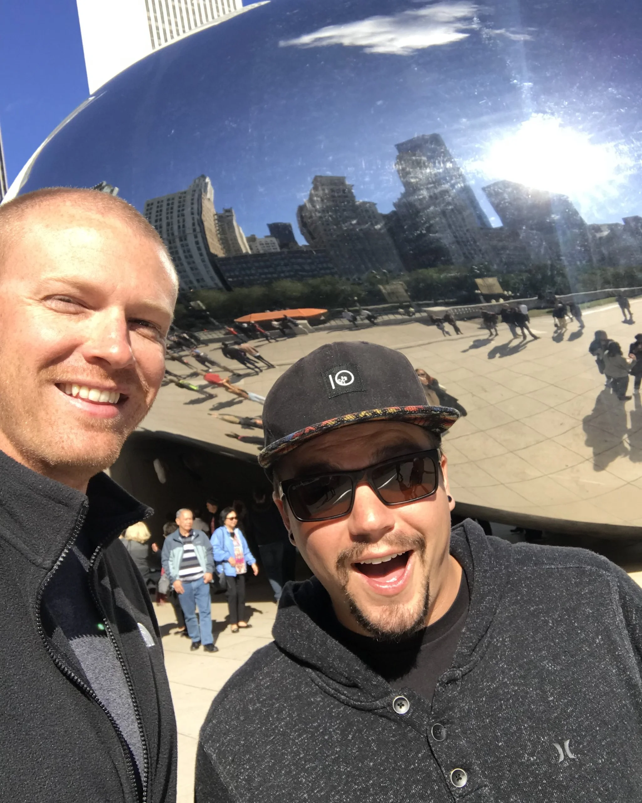 Derek and Josh taking a selfie in front of the Bean in Chicago