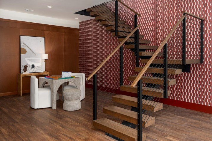 The floating white oak staircase in the Sweet Homes house
