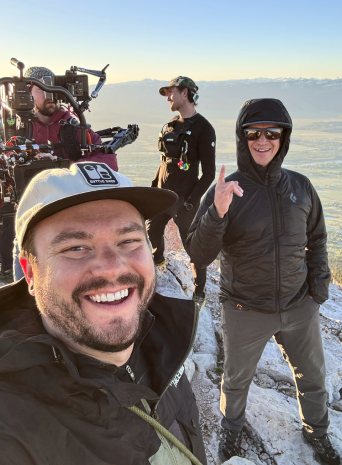 A selfie with the crew and camera rig on the summit at sunrise