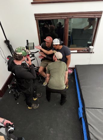 The crew setting up a shot with Jimmy Chin in the gym